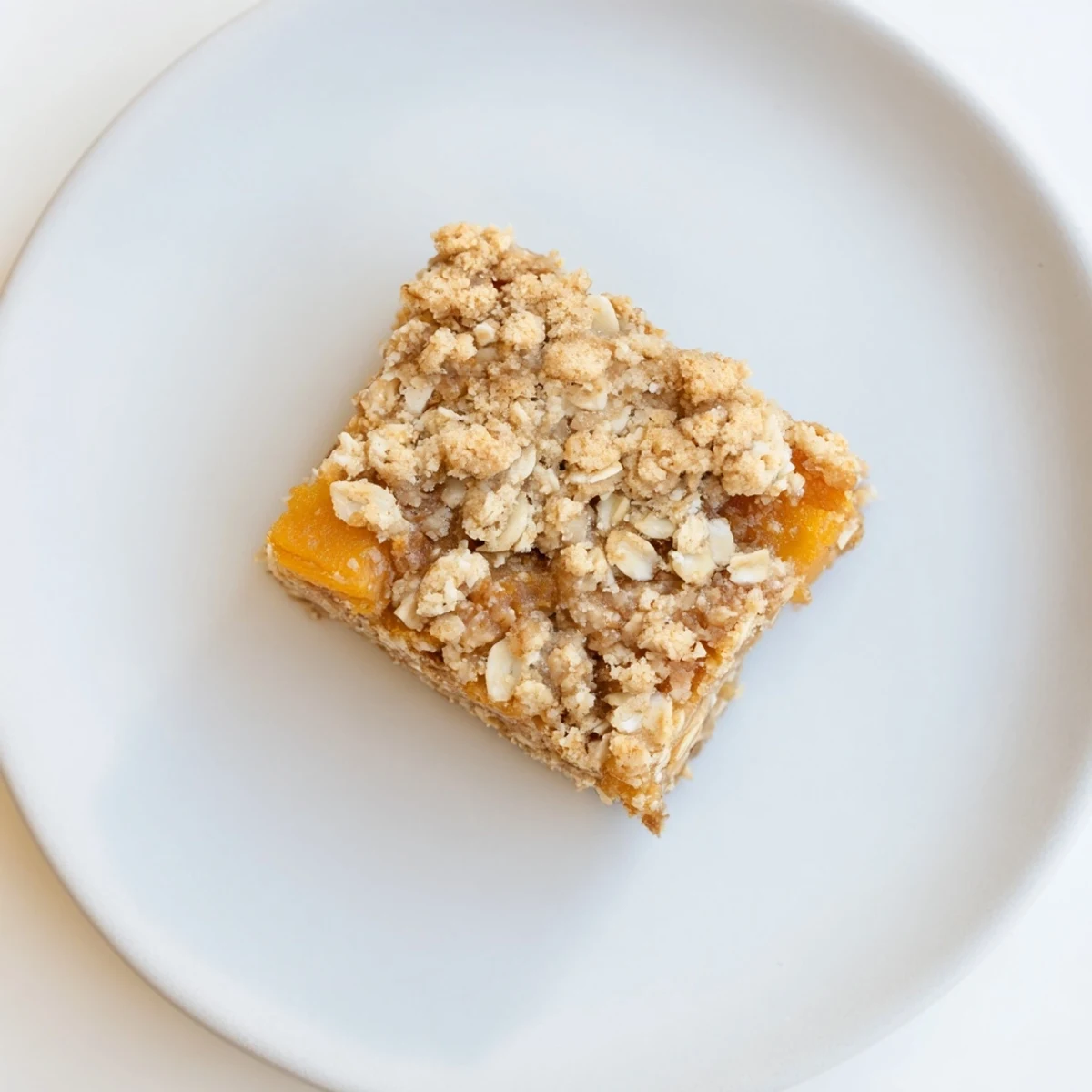 Golden gluten-free oatmeal apricot bars with sweet fruit filling and crumbly oat topping