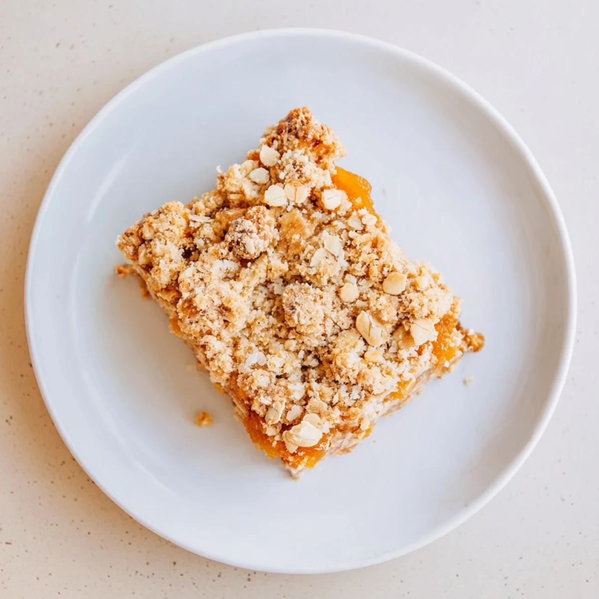 Chewy gluten-free oatmeal apricot bars fresh from the oven with tender apricot center