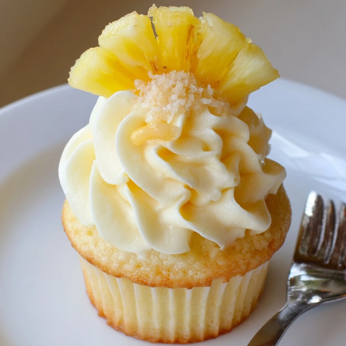 Golden Dole Whip Cupcakes Recipe with swirled pineapple frosting and fluffy crumb