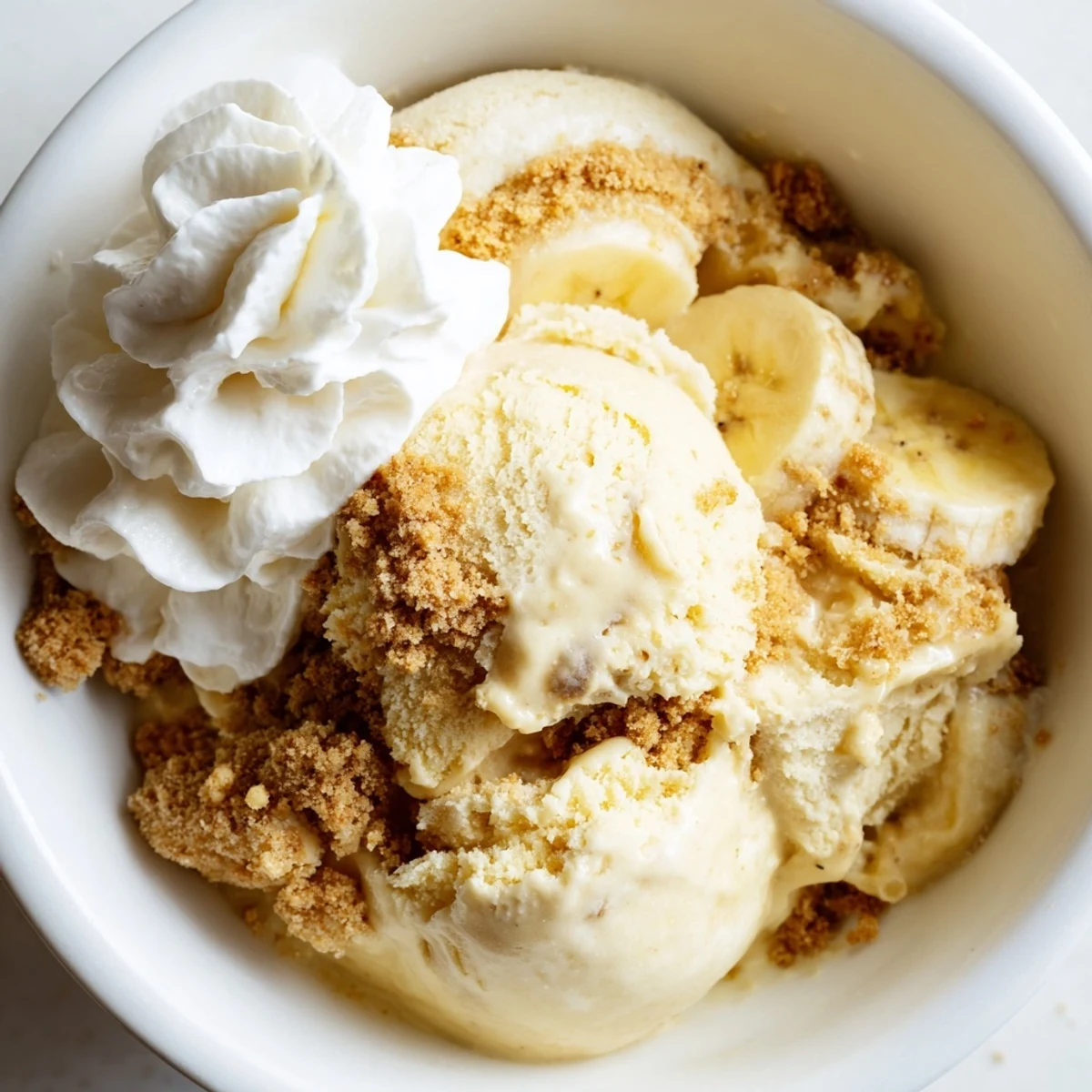 Silky Ninja Creami Banana Cream Pie Ice Cream with graham cracker swirls  