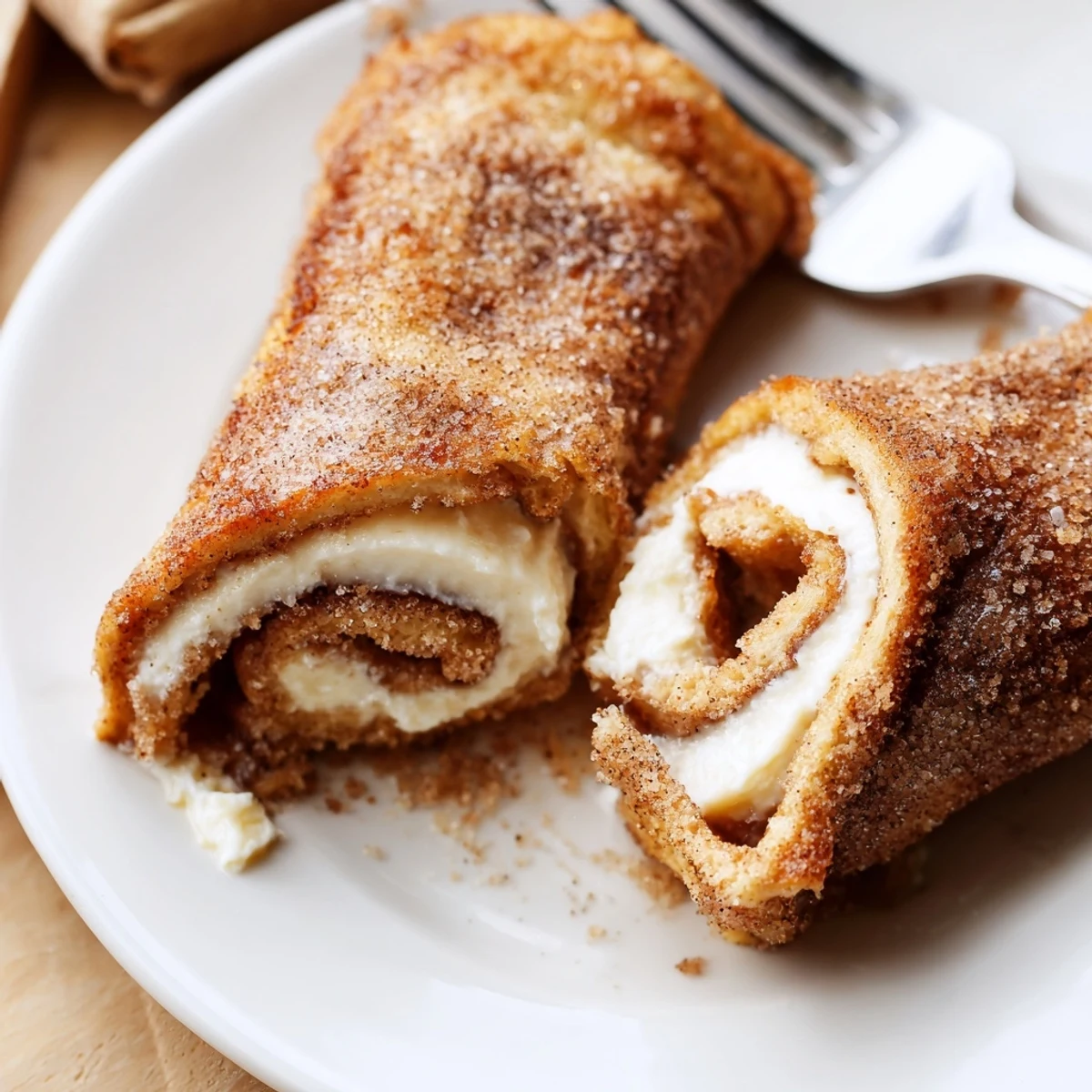 Cinnamon Roll French Toast Roll Ups with cream cheese filling and syrup