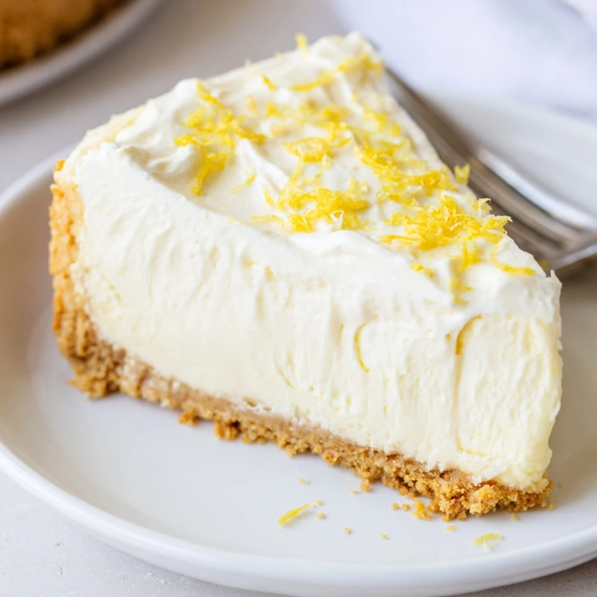 Classic Cheesecake with buttery graham crust, creamy center and fresh berries.